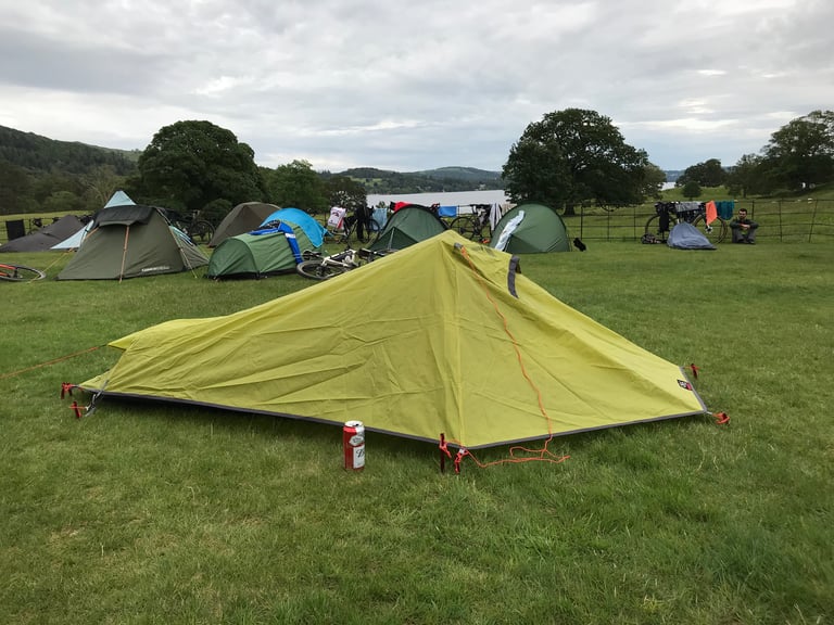 Tristan's OEX one-man tent pitched with a beer can beside it among other tents at The Distance camp at Brathay Hall.