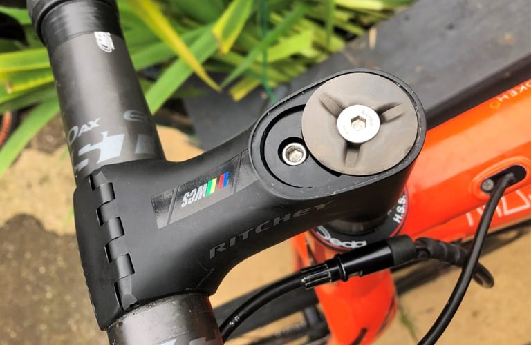 Ritchey WCS Chicane stem with the magnetic top cap off, showing the bolt and internal expander wedge fixing.