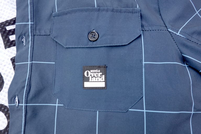 Buttoned breast pocket and small logo badge on the Morvelo Overland short sleeve shirt.