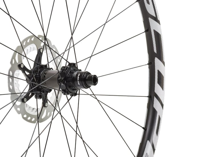 Close-up of a Scope O2 rear hub with XD driver body, disc rotor and spokes on a white background.