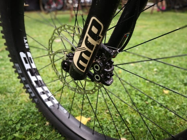 Magura Trail Sport disc brake caliper and rotor on the front wheel of the Bombtrack Cale, close up.