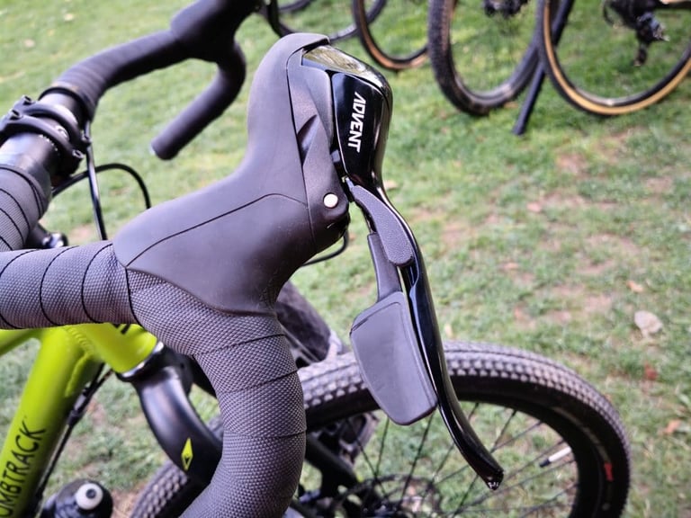 Microshift Advent shift and brake lever on the Bombtrack Beyond Junior's drop bars, close up.