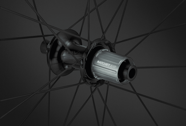 DT Swiss Ratchet EXP rear hub with 180EXP internals on a Roval Terra CLX EVO wheel, on a dark background.
