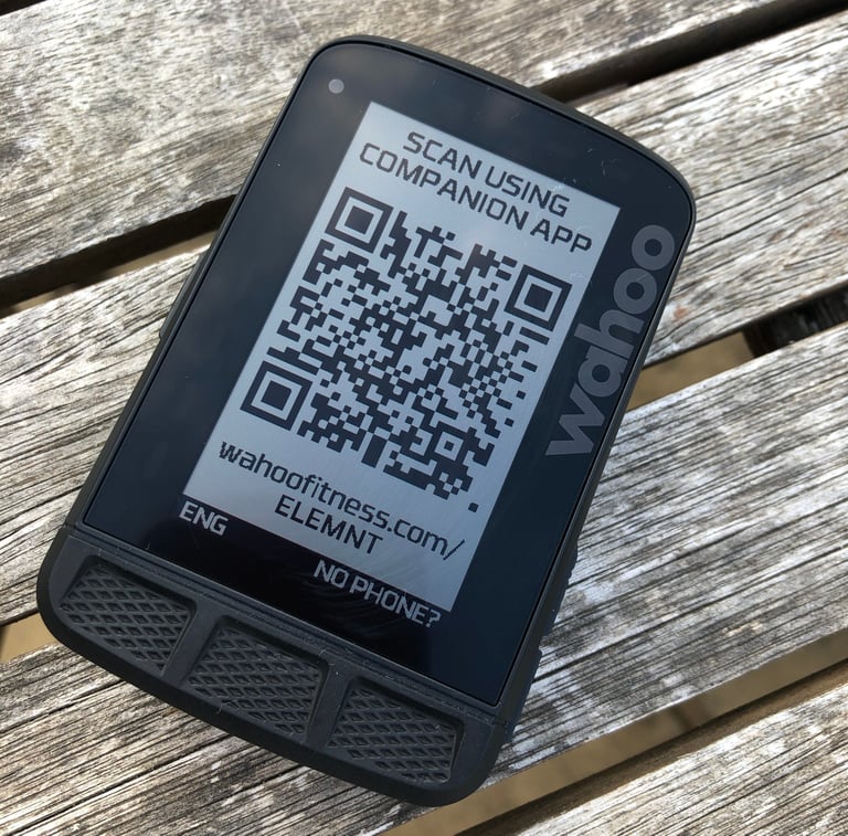 Wahoo ELEMNT ROAM screen showing a pairing QR code and a prompt to scan it using the Companion app.