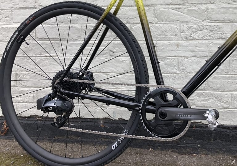 SRAM Force AXS 1x drivetrain and crank on a black and yellow gravel bike with Maxxis Speed Terrane tyres.