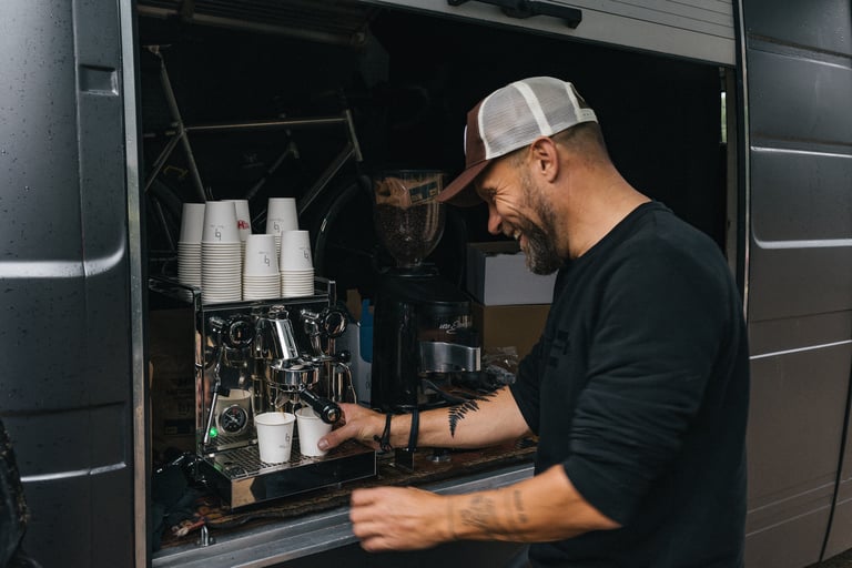 Werner Coolen pulls espresso shots from the machine in the back of his van at a Backyard Breakaway coffee stop.
