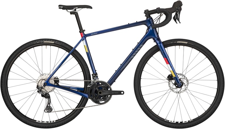 Salsa Warbird GRX 600 in dark blue with red and yellow accents, side view, on WTB wheels.