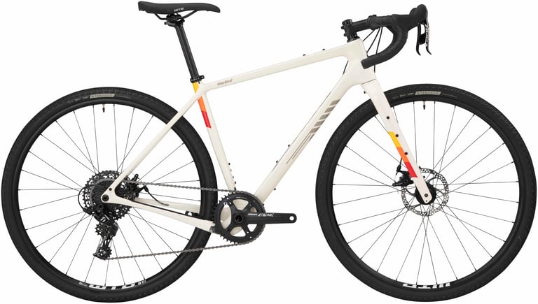 Salsa Warbird Apex 1 in white with orange and red decals, side view, with SRAM Apex 1x drivetrain.