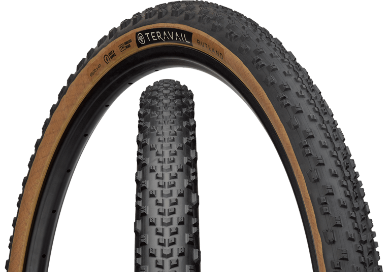 Studio shot of the Teravail Rutland 650b x 47 tan-wall tyre, showing the sidewall and the ramped centre tread.