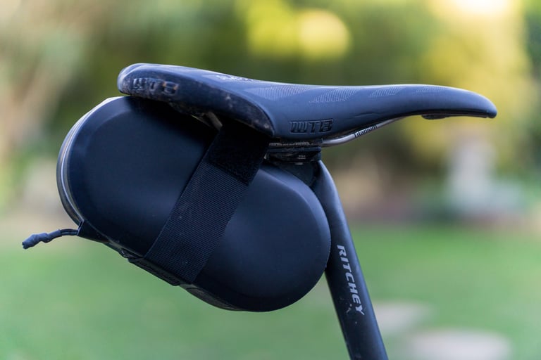 Arundel Gordo waterproof seat bag, side view, strapped under a WTB saddle on a Ritchey seatpost.