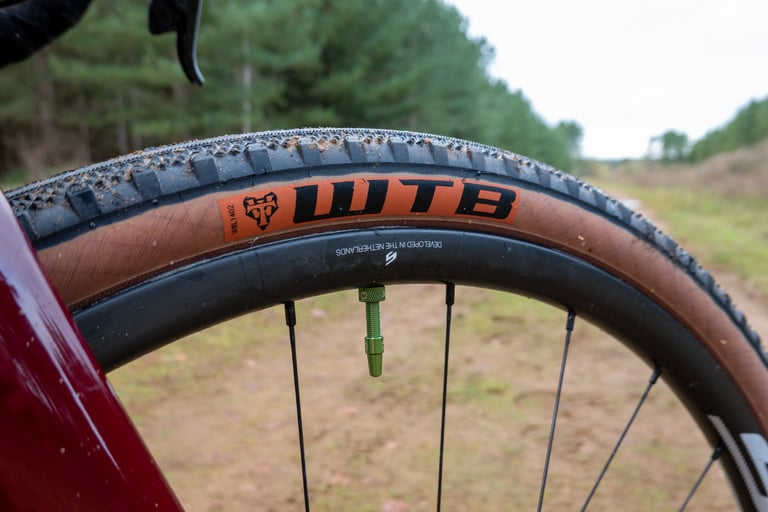WTB Byway tyre on a Scope O2 rim with a green valve, the only sign of the CushCore insert inside.