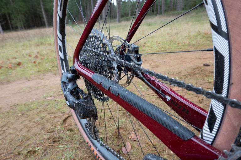 Carbon-effect Lizard Skins frame protector on the chainstay of the Cervelo Aspero, beside the SRAM Eagle cassette.