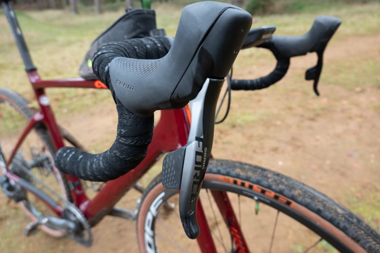 SRAM Force AXS shifter and brake lever on the flared bars of the Cervelo Aspero gravel racer.