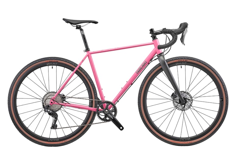 Pink Fairlight Secan gravel bike with tan-wall tyres and a Shimano GRX 800 1x drivetrain, side view.