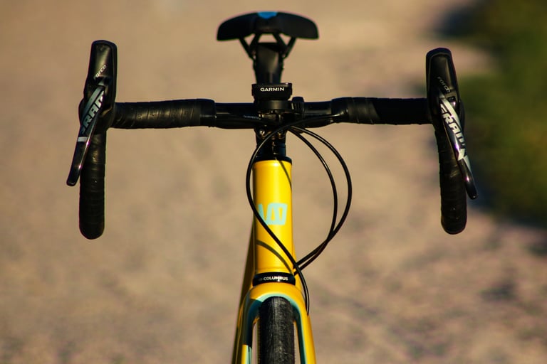 Front view of the Wish One SUB with SRAM Force shifters, black bar tape and a Garmin computer on the bars.