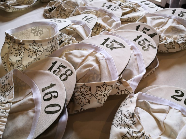 Numbered Atlas Mountain Race cycling caps laid out at race HQ in Marrakech, ahead of the 2020 start.