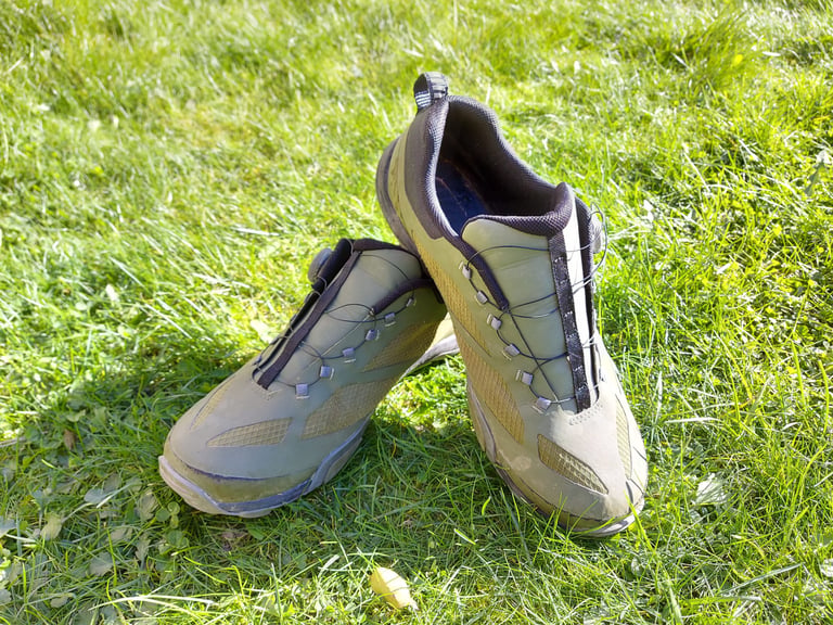 Shimano MT-7 shoes standing on grass after 750 miles, the mesh uppers still in good condition.