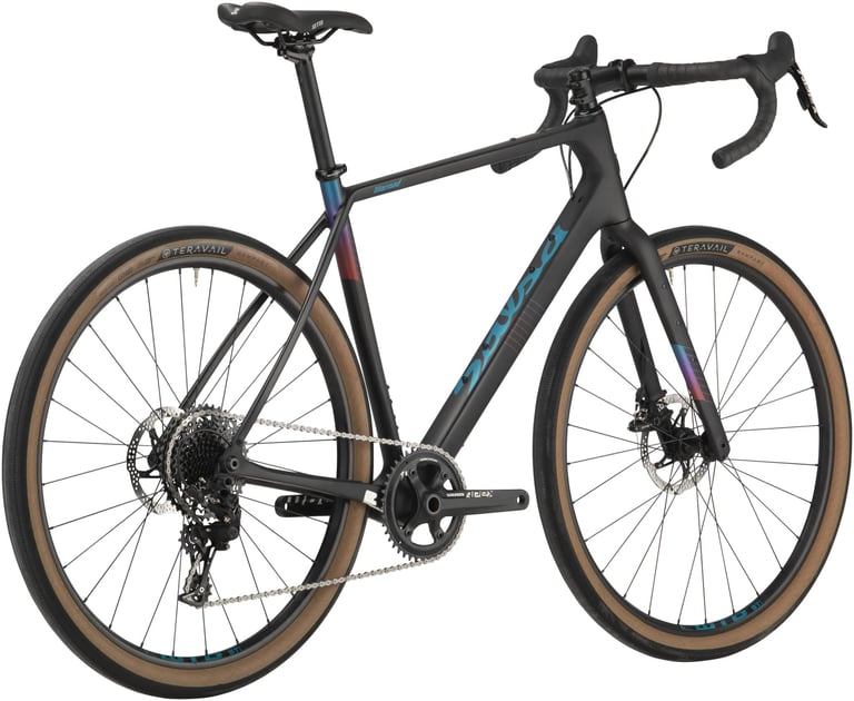Raw-carbon black Salsa Warroad Apex 1 with SRAM Apex 1x drivetrain and tan-wall Teravail tyres.