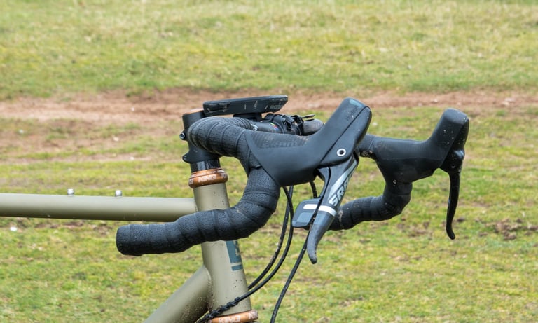 Side view of the Ritchey WCS Carbon VentureMax with SRAM levers and a GPS mount on a Bombtrack gravel bike.