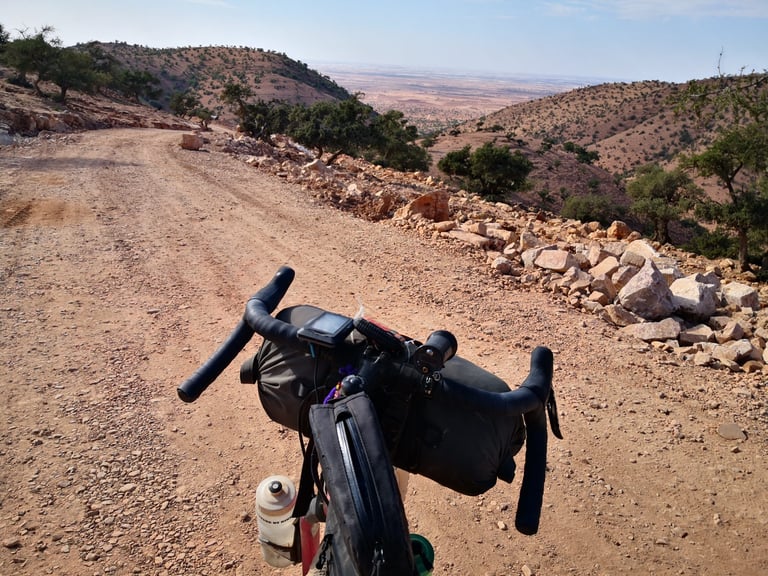 Salsa Cutthroat handlebar bag and a stony descent towards the plain on the final day of the Atlas Mountain Race.