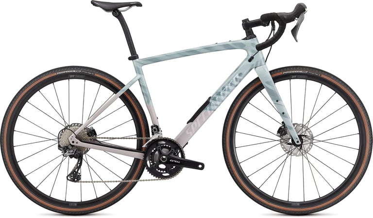Specialized Diverge Carbon Comp in pale ice blue fading to pink, with Shimano GRX and DT Swiss wheels.