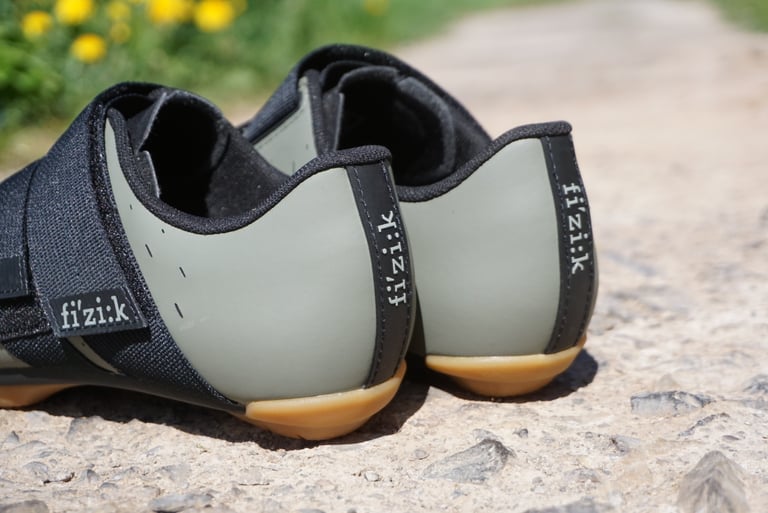 Rear view of the Fizik Terra Powerstrap X4 in khaki, showing the Fizik logo on the heel tab and gum rubber heels.