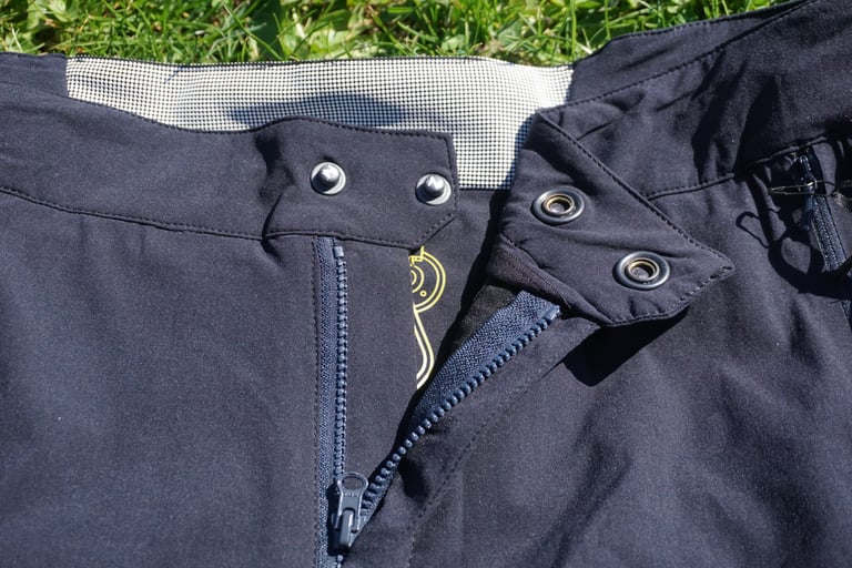 Front fly of the Overland Selector shorts open, showing the two poppers and the chunky plastic zip.