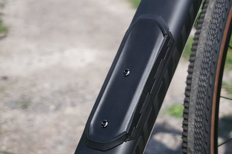 Closed SWAT storage door on the downtube of the Specialized Diverge, beside the front tyre.
