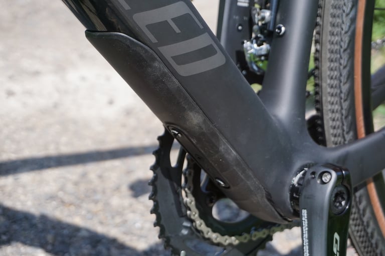 Rubber guard on the underside of the Diverge's down tube, above the bottom bracket and chainset.