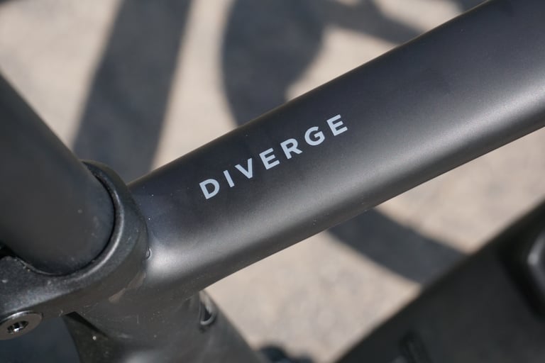 Close-up of the Diverge logo on the top tube of the Specialized Diverge Comp Carbon.
