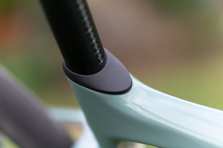 Giant Revolt Advanced D-Fuse carbon seatpost entering the frame with a black rubber collar.