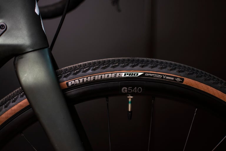 Close-up of a Specialized Pathfinder Pro tyre on a DT Swiss G540 rim beside the Diverge fork.