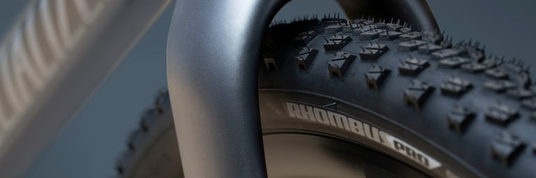 Close-up of the aggressive tread and branding on a Specialized Rhombus Pro gravel tyre fitted to the Diverge EVO.