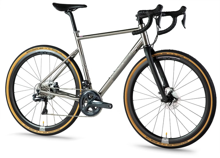 New Ribble CGR Ti Pro titanium gravel bike in three-quarter view with Ultegra Di2 and tan-wall tyres.