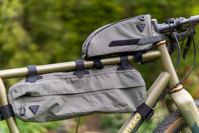 Topeak Midloader frame bag and Toploader on a green Bombtrack frame, showing the Midloader's small fit.