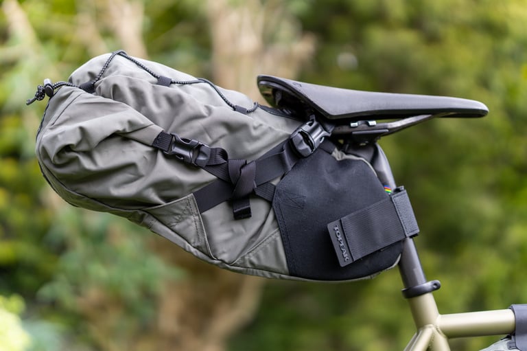 Topeak Backloader saddle bag in green, strapped to the seatpost and saddle rails.
