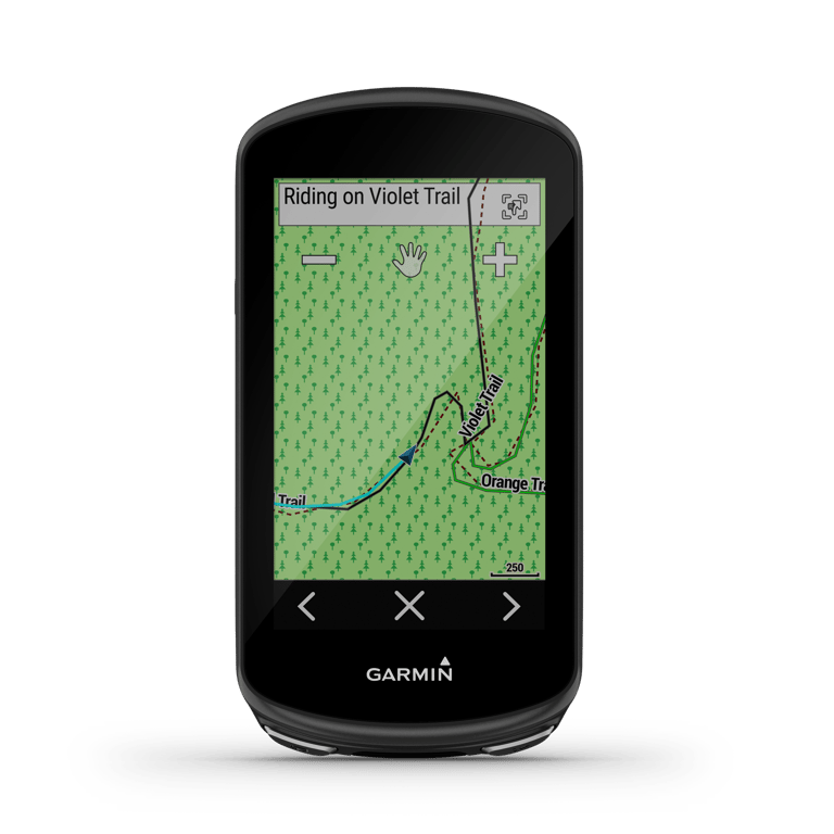 Garmin Edge 1030 Plus showing a green trail map with the rider's position on Violet Trail.