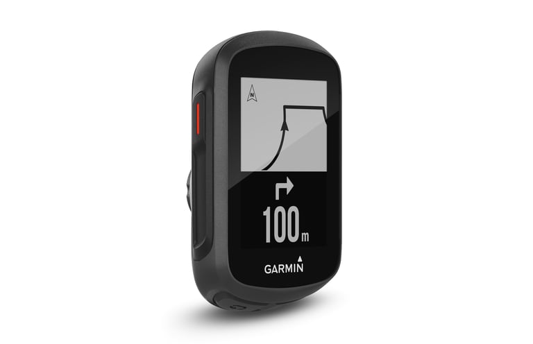 Garmin Edge 130 Plus at an angle with a map and a 100 m right-turn prompt on its screen.