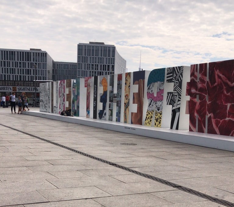 Colourful illustrated letter blocks on a Berlin square, passed on the way to the Grenzsteintrophy prologue.