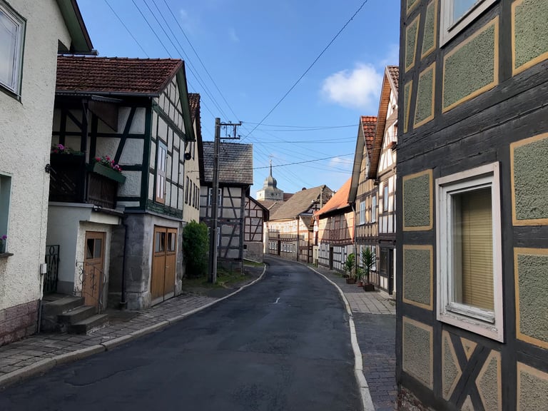Quiet street of half-timbered houses in Ummerstadt, Germany, passed during the Grenzsteintrophy.