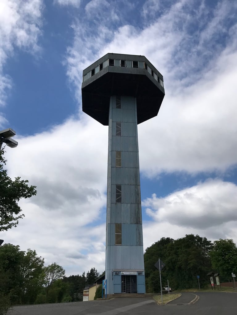 Octagonal Zimmerau viewing platform tower, built in 1965, rising above trees on the former inner German border.
