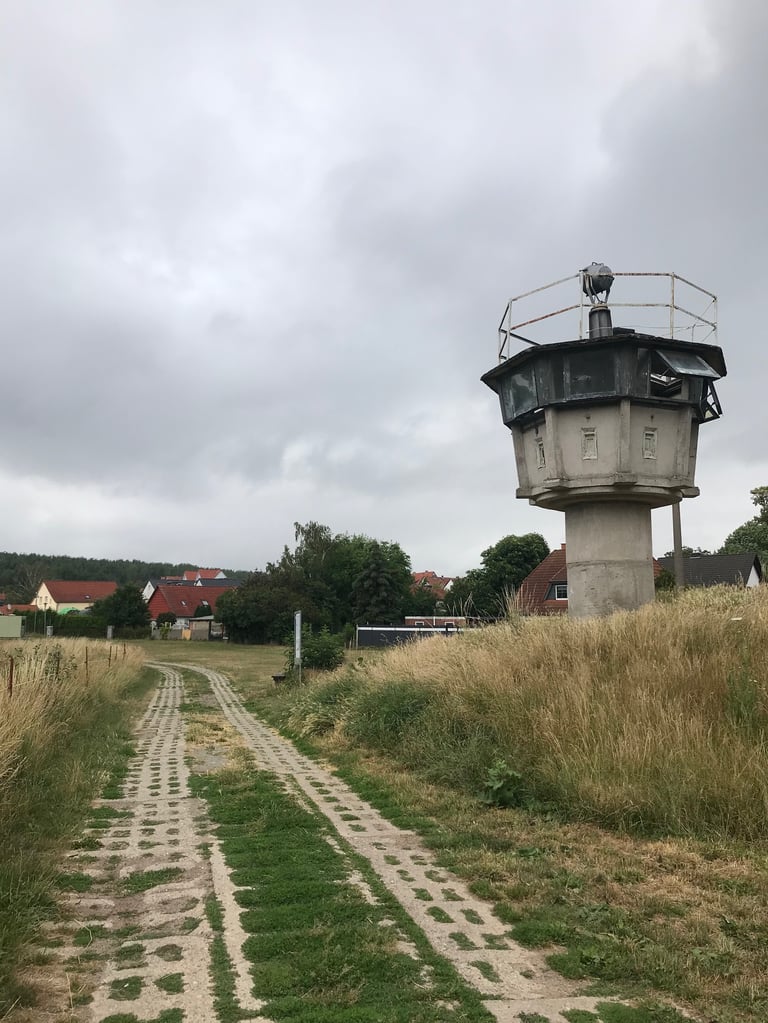 Hexagonal concrete border watchtower beside a panzer plate track near Hötensleben, Grenzsteintrophy route.