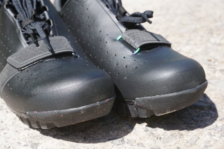 Toe boxes of the Rapha Explore Shoes with reinforced toe caps and scuffed rubber after testing.