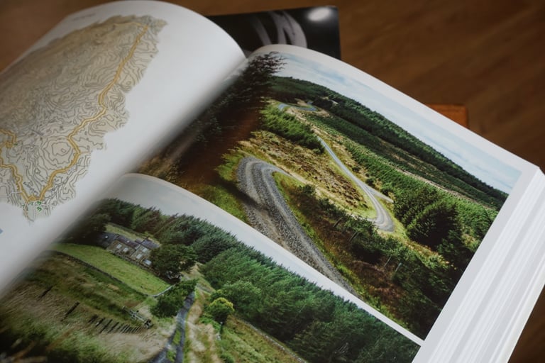 Lost Lanes North open at a full-page photograph of a winding gravel forest track, with a contour map opposite.