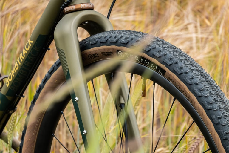 Teravail Sparwood 2.1in tan-wall tyre in the Bombtrack Hook EXT's steel fork, King headset cap above.