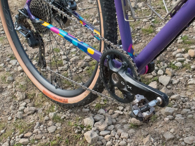 Shimano GRX 1x crank, chainring and SPD pedal on the Mercredi, with the spotted chainstay behind.
