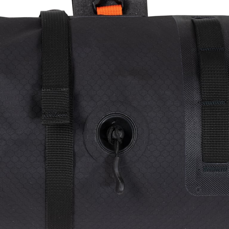 Close-up of the compression air valve on the reverse of the updated Ortlieb handlebar roll in black.