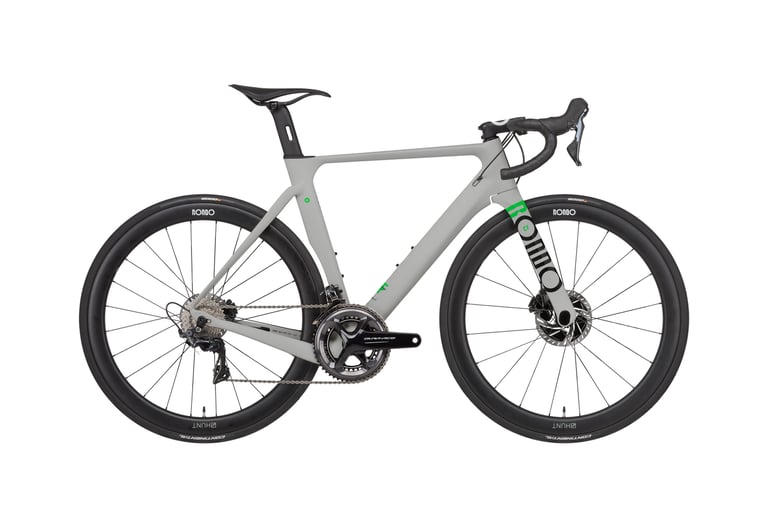 Rondo HVRT CF 0 road-plus bike in grey with green fork logo, Dura-Ace cranks and deep Hunt carbon wheels.