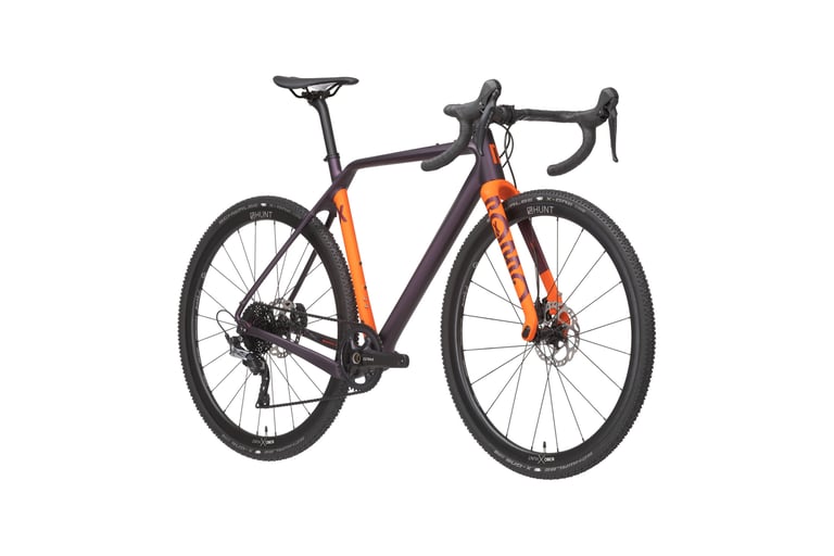 Rondo Ruut X cyclocross-style gravel bike in dark purple with orange fork and Hunt wheels with Schwalbe X-One tyres.