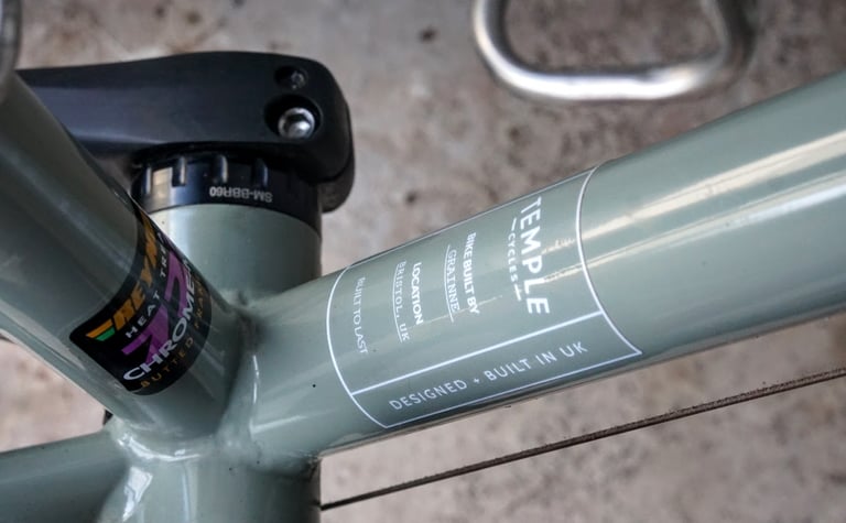 Temple Cycles 'Bike built by Grainne' sticker on the Adventure Disc 1 top tube, beside a Reynolds 725 decal.